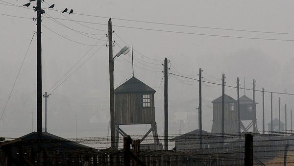 Watch towers and the barbed wire fence of the former Nazi death camp Majdanek outside the city of Lublin in eastern Poland on Wednesday Nov. 9, 2005. Four camp survivors and documentary film makers dug up trinkets and personal items buried by Jews in the spring of 1943 after arriving from the Warsaw ghetto - Sputnik International