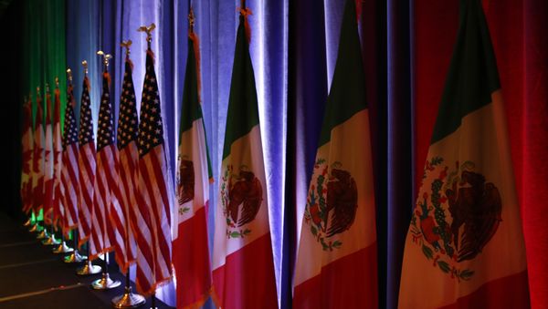 In this Aug. 16, 2017 file photo, the national flags of Canada, the U.S. and Mexico are lit by stage lights before a news conference, at the start of the North American Free Trade Agreement renegotiations in Washington In this Aug. 16, 2017 file photo, the national flags of Canada, the U.S. and Mexico are lit by stage lights before a news conference, at the start of the North American Free Trade Agreement renegotiations in Washington - Sputnik International