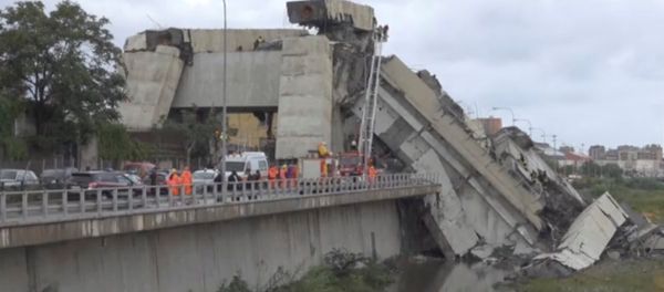 Rescue workers are seen at the collapsed Morandi Bridge in the Italian port city of Genoa, Italy August 14, 2018 in this still image taken from a video Rescue workers are seen at the collapsed Morandi Bridge in the Italian port city of Genoa, Italy August 14, 2018 in this still image taken from a video - Sputnik International