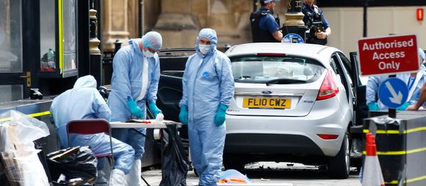 Forensic investigators work at the site after a car crashed outside the Houses of Parliament in Westminster, London, Britain, August 14, 2018 Forensic investigators work at the site after a car crashed outside the Houses of Parliament in Westminster, London, Britain, August 14, 2018 - Sputnik International
