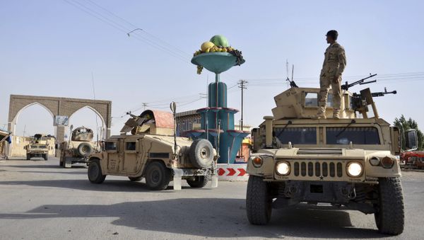 In this Sunday, Aug. 12, 2018, photo, Afghan security personnel patrol in the city of Ghazni province west of Kabul, Afghanistan. - Sputnik International