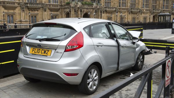 The car that was driven at pedestrians and cyclists in Westminster then crashed into the barrier outside the Houses of Parliament on Tuesday is seen in an image handed out by the Metropolitan Police in London, August 15, 2018 - Sputnik International