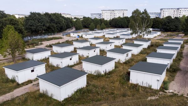 In this Aug. 16, 2018 photo houses originally built for refugees sit on the site of a former refugee center in Hamburg, Germany - Sputnik International