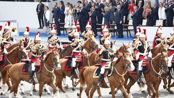 President Donald Trump and French President Emmanuel Macron during Bastille Day parade on the Champs Elysees avenue in Paris, Friday, July 14, 2017. - Sputnik International