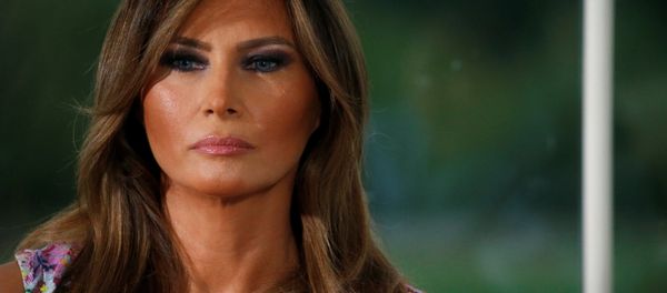 First lady Melania Trump listens as her husband U.S. President Donald Trump speaks at a dinner with business leaders at Trump National Golf Club in Bedminster, New Jersey, U.S., August 7, 2018 First lady Melania Trump listens as her husband U.S. President Donald Trump speaks at a dinner with business leaders at Trump National Golf Club in Bedminster, New Jersey, U.S., August 7, 2018 - Sputnik International