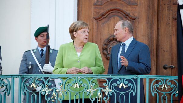 German Chancellor Angela Merkel and Russian President Vladimir Putin give statements ahead of a meeting at the German government guest house Meseberg Palace in Gransee, Germany August 18, 2018. German Chancellor Angela Merkel and Russian President Vladimir Putin give statements ahead of a meeting at the German government guest house Meseberg Palace in Gransee, Germany August 18, 2018. - Sputnik International