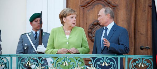 German Chancellor Angela Merkel and Russian President Vladimir Putin give statements ahead of a meeting at the German government guest house Meseberg Palace in Gransee, Germany August 18, 2018. German Chancellor Angela Merkel and Russian President Vladimir Putin give statements ahead of a meeting at the German government guest house Meseberg Palace in Gransee, Germany August 18, 2018. - Sputnik International