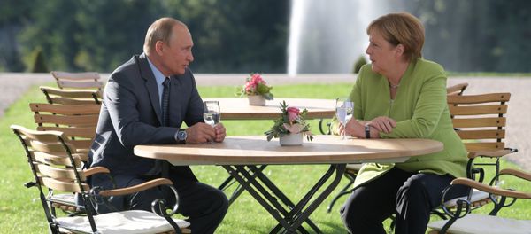 German Chancellor Angela Merkel and Russian President Vladimir Putin German Chancellor Angela Merkel and Russian President Vladimir Putin - Sputnik International