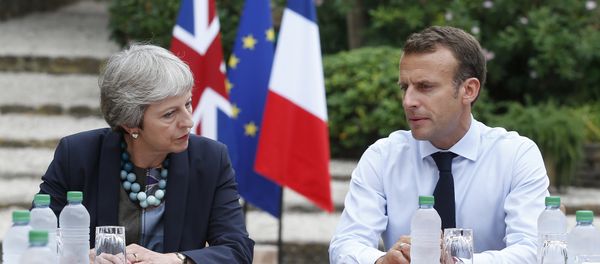 French President Emmanuel Macron, right, meets with British Prime Minister Theresa May to discuss Brexit issues at the Fort de Bregancon in Bornes-les-Mimosas, southern France, Friday Aug. 3, 2018 French President Emmanuel Macron, right, meets with British Prime Minister Theresa May to discuss Brexit issues at the Fort de Bregancon in Bornes-les-Mimosas, southern France, Friday Aug. 3, 2018 - Sputnik International