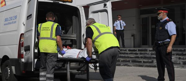 The body of a man who tried to attack a police station is carried out of the premises in Cornella near the northeastern Spanish city of Barcelona on August 20, 2018 The body of a man who tried to attack a police station is carried out of the premises in Cornella near the northeastern Spanish city of Barcelona on August 20, 2018 - Sputnik International