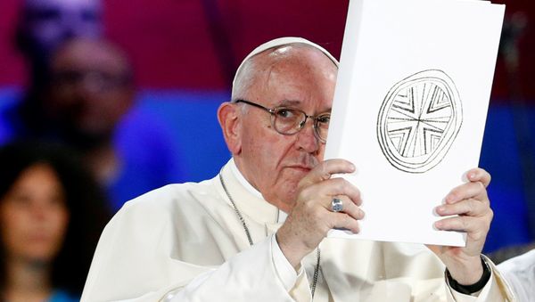 Pope Francis holds the Book of the Gospels as he meets Italian youth at the ancient Circo Massimo in Rome, Italy August 11, 2018 - Sputnik International