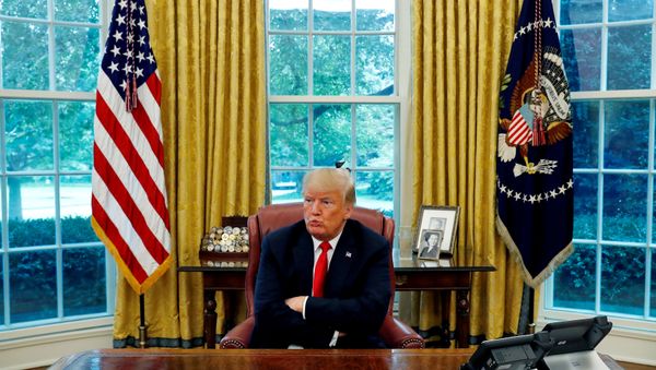 U.S. President Donald Trump reacts to a question during an interview with Reuters in the Oval Office of the White House in Washington, U.S. August 20, 2018 - Sputnik International