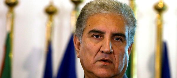 Pakistan's new Foreign Minister Shah Mehmood Qureshi listens during a news conference at the Foreign Ministry in Islamabad, Pakistan August 20, 2018 Pakistan's new Foreign Minister Shah Mehmood Qureshi listens during a news conference at the Foreign Ministry in Islamabad, Pakistan August 20, 2018 - Sputnik International