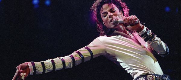 In this Feb. 24, 1988 file photo, Michael Jackson leans, points and sings, dances and struts during the opening performance of his 13-city U.S. tour, in Kansas City - Sputnik International