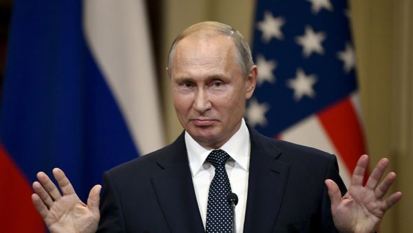 Russia's President Vladimir Putin gestures during the joint press conference with US President Donald Trump in the Presidential Palace in Helsinki, Finland July 16, 2018 - Sputnik International