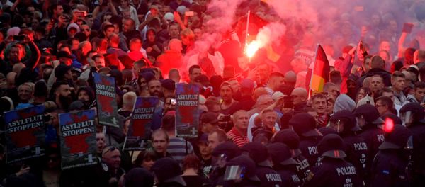 Right-wing supporters protest after a German man was stabbed last weekend in Chemnitz, Germany, August 27, 2018. Right-wing supporters protest after a German man was stabbed last weekend in Chemnitz, Germany, August 27, 2018. - Sputnik International