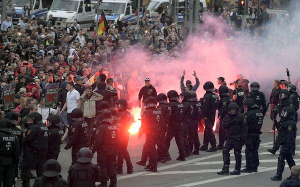Protesters light fireworks during a far-right demonstration in Chemnitz, Germany, Monday, Aug. 27, 2018 after a man has died and two others were injured in an altercation between several people of various nationalities in the eastern German city of Chemnitz on Sunday Protesters light fireworks during a far-right demonstration in Chemnitz, Germany, Monday, Aug. 27, 2018 after a man has died and two others were injured in an altercation between several people of various nationalities in the eastern German city of Chemnitz on Sunday - Sputnik International