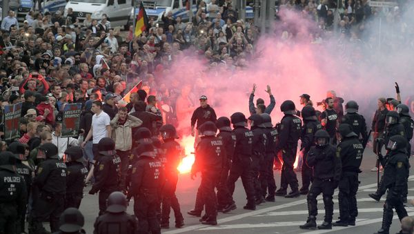 Protesters light fireworks during a right-wing demonstration in Chemnitz, Germany, Aug. 27, 2018 - Sputnik International