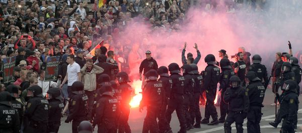 Protesters light fireworks during a far-right demonstration in Chemnitz, Germany, Monday, Aug. 27, 2018 after a man has died and two others were injured in an altercation between several people of various nationalities in the eastern German city of Chemnitz on Sunday - Sputnik International