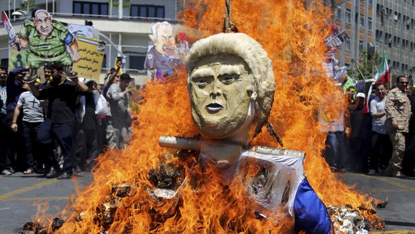 In this Friday, June 8, 2018, photo, an effigy of the U.S. President Donald Trump is set on fire during the annual anti-Israeli Al-Quds, Jerusalem, Day rally in Tehran, Iran - Sputnik International