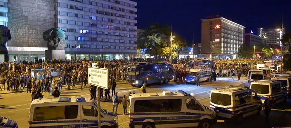 Police vehicles are seen as right-wing supporters protest after a German man was stabbed last weekend in Chemnitz, Germany, August 27, 2018 Police vehicles are seen as right-wing supporters protest after a German man was stabbed last weekend in Chemnitz, Germany, August 27, 2018 - Sputnik International