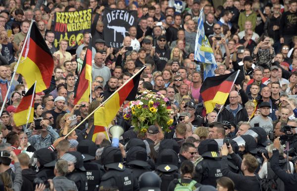 Protesters carry a wreath as they gather for a far-right protest in Chemnitz, Germany, Monday, Aug. 27, 2018 after a man has died and two others were injured in an altercation between several people of various nationalities in the eastern German city of Chemnitz on Sunday - Sputnik International
