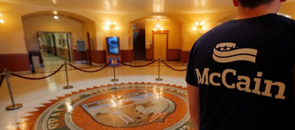 An event organizer wears a McCain t-shirt in the Rotunda of the Arizona State Capitol, where the late U.S. Senator John McCain will lie in state, in Phoenix, Arizona, U.S., August 27, 2018 An event organizer wears a McCain t-shirt in the Rotunda of the Arizona State Capitol, where the late U.S. Senator John McCain will lie in state, in Phoenix, Arizona, U.S., August 27, 2018 - Sputnik International