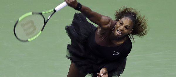 Serena Williams, of the United States, serves to Magda Linette, of Poland, during the first round of the U.S. Open tennis tournament, Monday, Aug. 27, 2018, in New York - Sputnik International