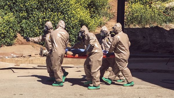 April 4, 2017 and made available Wednesday, April 5, Turkish experts carry a victim of alleged chemical weapons attacks in Syrian city of Idlib, at a local hospital in Reyhanli, Hatay, Turkey April 4, 2017 and made available Wednesday, April 5, Turkish experts carry a victim of alleged chemical weapons attacks in Syrian city of Idlib, at a local hospital in Reyhanli, Hatay, Turkey - Sputnik International