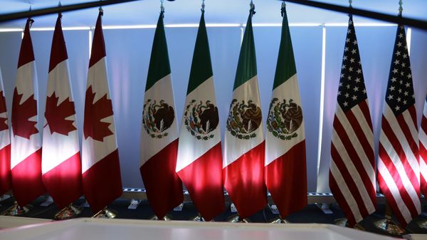 National flags representing Canada, Mexico, and the US are lit by stage lights at the North American Free Trade Agreement, NAFTA, renegotiations, in Mexico City, Tuesday, Sept. 5, 2017. - Sputnik International