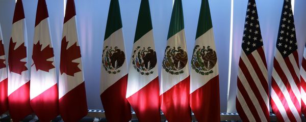 National flags representing Canada, Mexico, and the US are lit by stage lights at the North American Free Trade Agreement, NAFTA, renegotiations, in Mexico City, Tuesday, Sept. 5, 2017. - Sputnik International