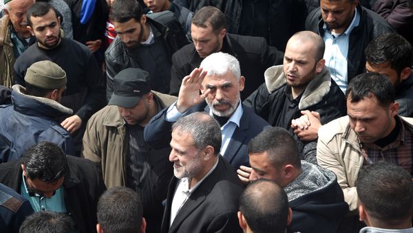 Islamist Hamas movement leader Yahya Sinwar (C) takes part in a tent city protest near the border with Israel east of Jabalia in the northern Gaza strip on March 30, 2018 to commemorate Land Day - Sputnik International