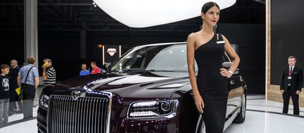 A model poses at the Aurus company stand during the 2018 Moscow International Auto Show. A model poses at the Aurus company stand during the 2018 Moscow International Auto Show. - Sputnik International