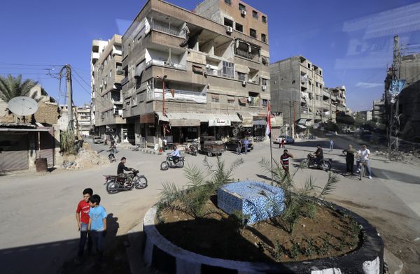 In a picture taken through a bus window, people drive their motorcycles in Damascus, Syria, Monday, Aug. 13, 2018 - Sputnik International