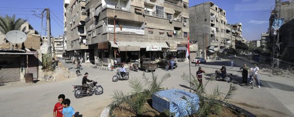 In a picture taken through a bus window, people drive their motorcycles in Damascus, Syria, Monday, Aug. 13, 2018 - Sputnik International