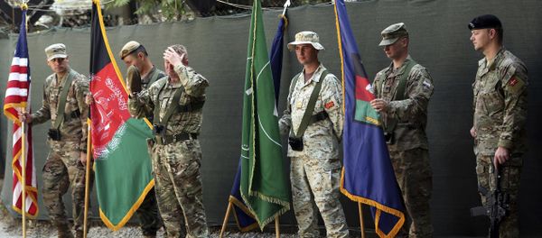 Afghanistan and NATO soldiers hold their flags before the start of the change of command ceremony at Resolute Support headquarters, in Kabul, Afghanistan, Sunday, Sept. 2, 2018 Afghanistan and NATO soldiers hold their flags before the start of the change of command ceremony at Resolute Support headquarters, in Kabul, Afghanistan, Sunday, Sept. 2, 2018 - Sputnik International