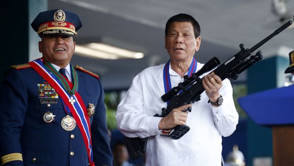 April 19, 2018 file photo, Philippine President Rodrigo Duterte, right, jokes to photographers as he holds an Israeli-made Galil rifle which was presented to him by former Philippine National Police Chief Director General Ronald Bato Dela Rosa at the turnover-of-command ceremony at the Camp Crame in Quezon city northeast of Manila April 19, 2018 file photo, Philippine President Rodrigo Duterte, right, jokes to photographers as he holds an Israeli-made Galil rifle which was presented to him by former Philippine National Police Chief Director General Ronald Bato Dela Rosa at the turnover-of-command ceremony at the Camp Crame in Quezon city northeast of Manila - Sputnik International