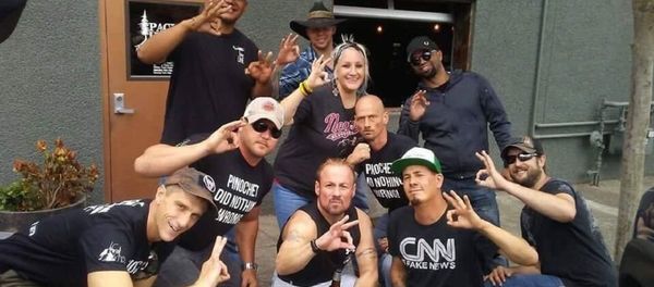 Patriot Prayer + Proud Boys in Vancouver night b4 Aug 4 Portland rally many fear will end in violence. Tusitala Tiny Toese and others make an apparent White Power hand gesture. T-shirts read, Pinochet Did Nothing Wrong. - Sputnik International
