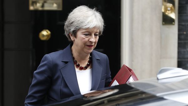 Britain's Prime Minister Theresa May leaves 10 Downing street to take part in Prime Ministers questions at the House of Commons in London on September 5, 2018. Britain's Prime Minister Theresa May leaves 10 Downing street to take part in Prime Ministers questions at the House of Commons in London on September 5, 2018. - Sputnik International