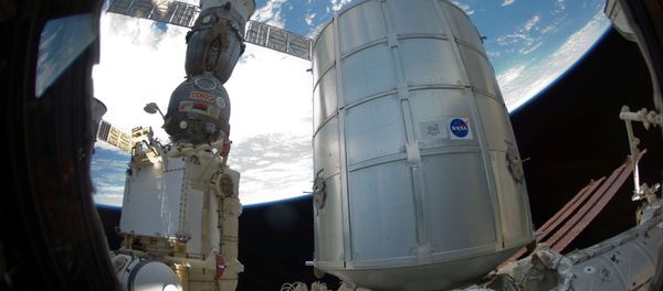 Permanent Multipurpose Module (PMM) and a docked Russian Soyuz spacecraft - Sputnik International