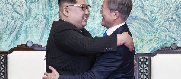 North Korean leader Kim Jong Un, left, and South Korean President Moon Jae-in embrace each other after signing on a joint statement at the border village of Panmunjom in the Demilitarized Zone, South Korea, Friday, April 27, 2018. North Korean leader Kim Jong Un, left, and South Korean President Moon Jae-in embrace each other after signing on a joint statement at the border village of Panmunjom in the Demilitarized Zone, South Korea, Friday, April 27, 2018. - Sputnik International