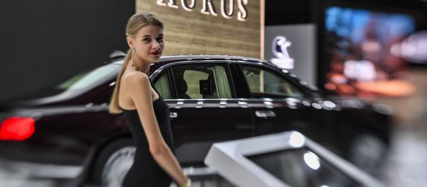 A girl posing at the Aurus Senat car at the Moscow International Motor Show 2018. A girl posing at the Aurus Senat car at the Moscow International Motor Show 2018. - Sputnik International