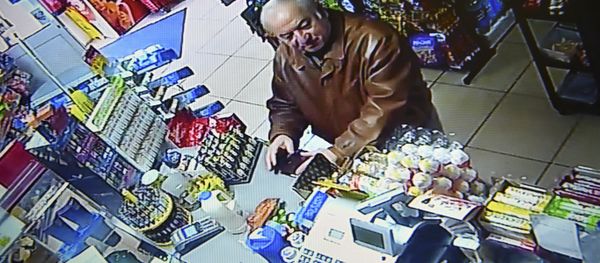 A still image from CCTV footage recorded on February 27, 2018 shows former Russian spy Sergei Skripal buying groceries at the Bargain Stop convenience store in Salisbury on February 27, 2018. - Sputnik International