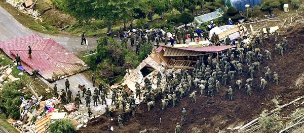 Members of the Japan Self-Defense Forces (JSDF) search for survivors from a house damaged by a landslide caused by an earthquake in Atsuma town, Hokkaido, northern Japan, in this photo taken by Kyodo September 7, 2018 Members of the Japan Self-Defense Forces (JSDF) search for survivors from a house damaged by a landslide caused by an earthquake in Atsuma town, Hokkaido, northern Japan, in this photo taken by Kyodo September 7, 2018 - Sputnik International
