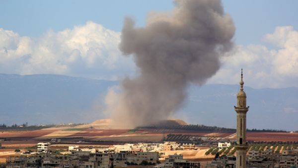 Smoke raises in the Syrian village of Kafr Ain in the southern countryside of Idlib province after an airstrike on September 7, 2018 Smoke raises in the Syrian village of Kafr Ain in the southern countryside of Idlib province after an airstrike on September 7, 2018 - Sputnik International