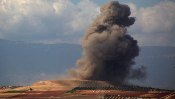 Smoke rises near the Syrian village of Kafr Ain in the southern countryside of Idlib province after an airstrike on September 7, 2018 - Sputnik International