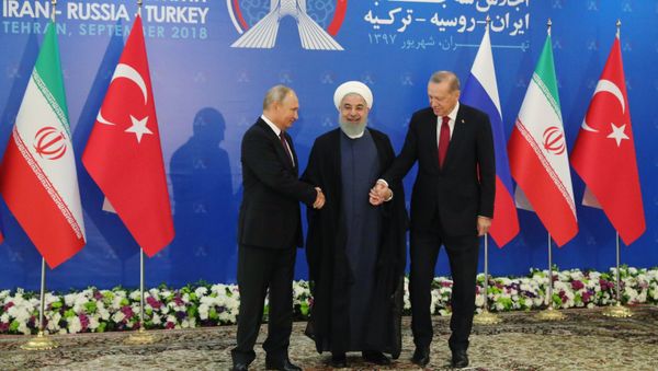 Russian President Vladimir Putin, Iranian President Hassan Rouhani, and Turkish President Recep Tayyip Erdogan during trilateral talks in Tehran. Russian President Vladimir Putin, Iranian President Hassan Rouhani, and Turkish President Recep Tayyip Erdogan during trilateral talks in Tehran. - Sputnik International