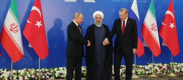 Russian President Vladimir Putin, Iranian President Hassan Rouhani, and Turkish President Recep Tayyip Erdogan during trilateral talks in Tehran. Russian President Vladimir Putin, Iranian President Hassan Rouhani, and Turkish President Recep Tayyip Erdogan during trilateral talks in Tehran. - Sputnik International