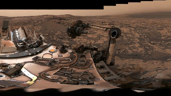 After snagging a new rock sample on August 9, 2018 (Sol 2137), NASA's Curiosity rover surveyed its surroundings on Mars, producing a 360-degree panorama of its current location on Vera Rubin Ridge. The scene is presented with a color adjustment that approximates white balancing, to resemble how the rocks and sand would appear under daytime lighting conditions on Earth. - Sputnik International