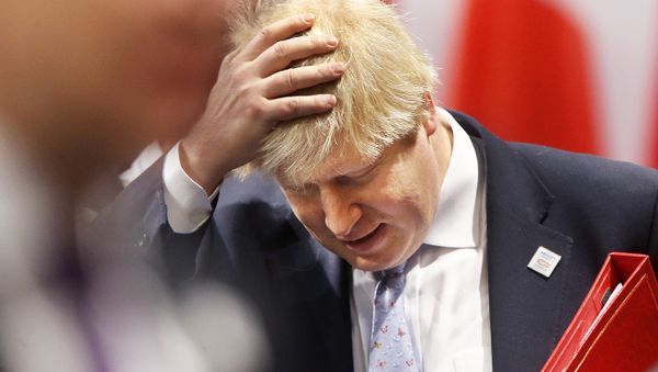 Britain's Prime Minister Boris Johnson adjusts his hair while he was Foreign Secretary at the beginning of a working session during the G-20 Foreign Ministers meeting in Bonn, Germany, Thursday, 16 February 2017.  - Sputnik International